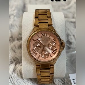 Rose Gold Michael Kors Watch with Peach colored face.